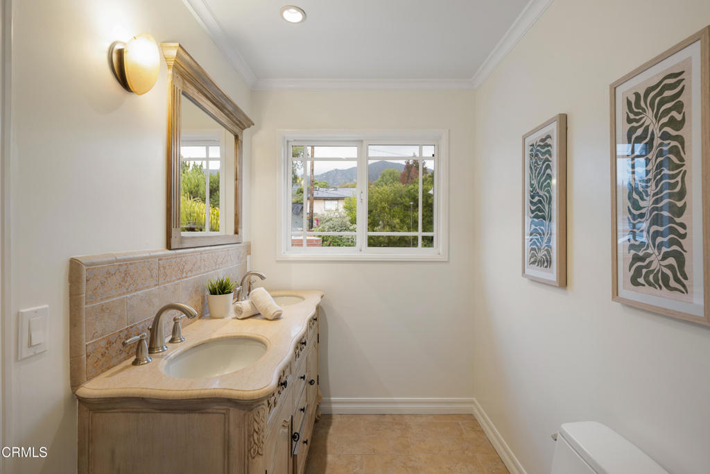 941 Chehalem Road La Canada Flintridge, CA 91011 - Photo 40 of 74 a bathroom with a sink and a mirror