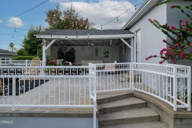 a view of house with garden space and trees