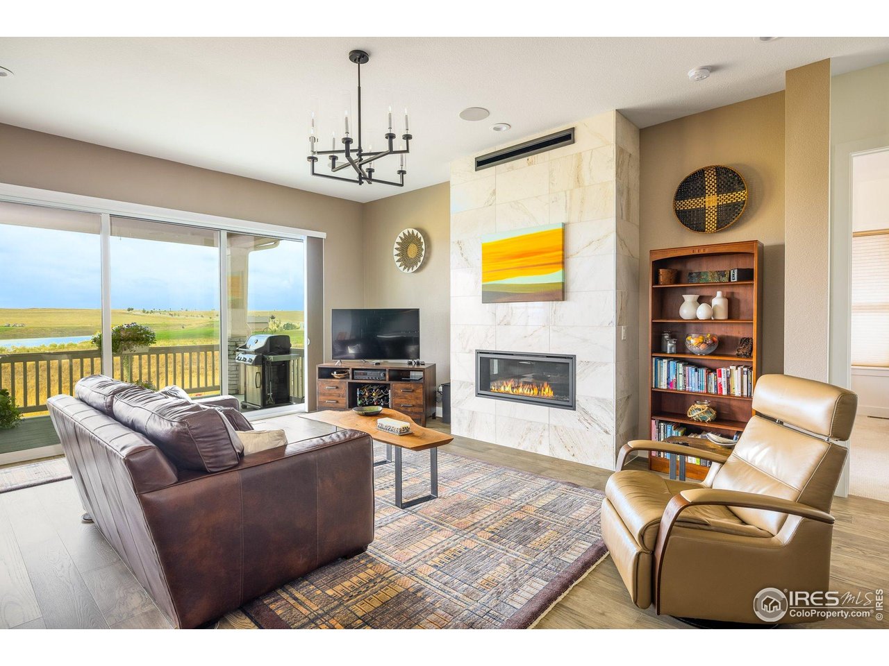 a living room with fireplace furniture and a flat screen tv