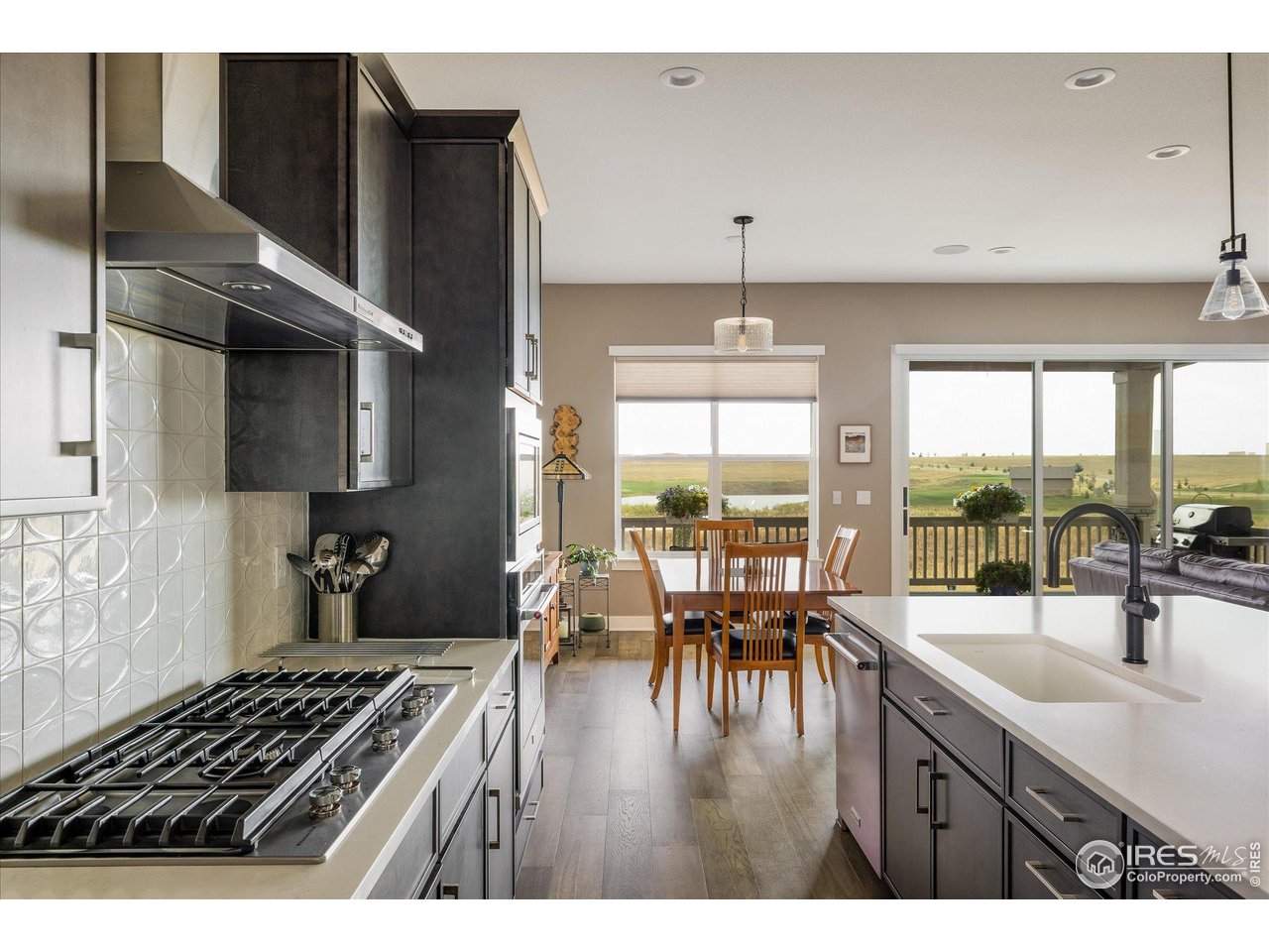 2940 Newfound Lk Road Berthoud, CO 80513 - Photo 12 of 42 a kitchen with stainless steel appliances granite countertop a stove and a sink