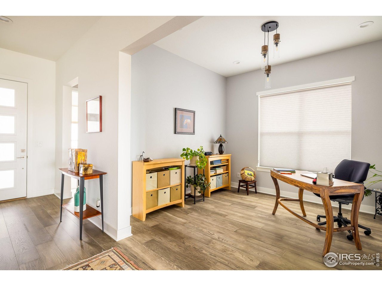 2940 Newfound Lk Road Berthoud, CO 80513 - Photo 14 of 42 a living room with furniture and a wooden floor