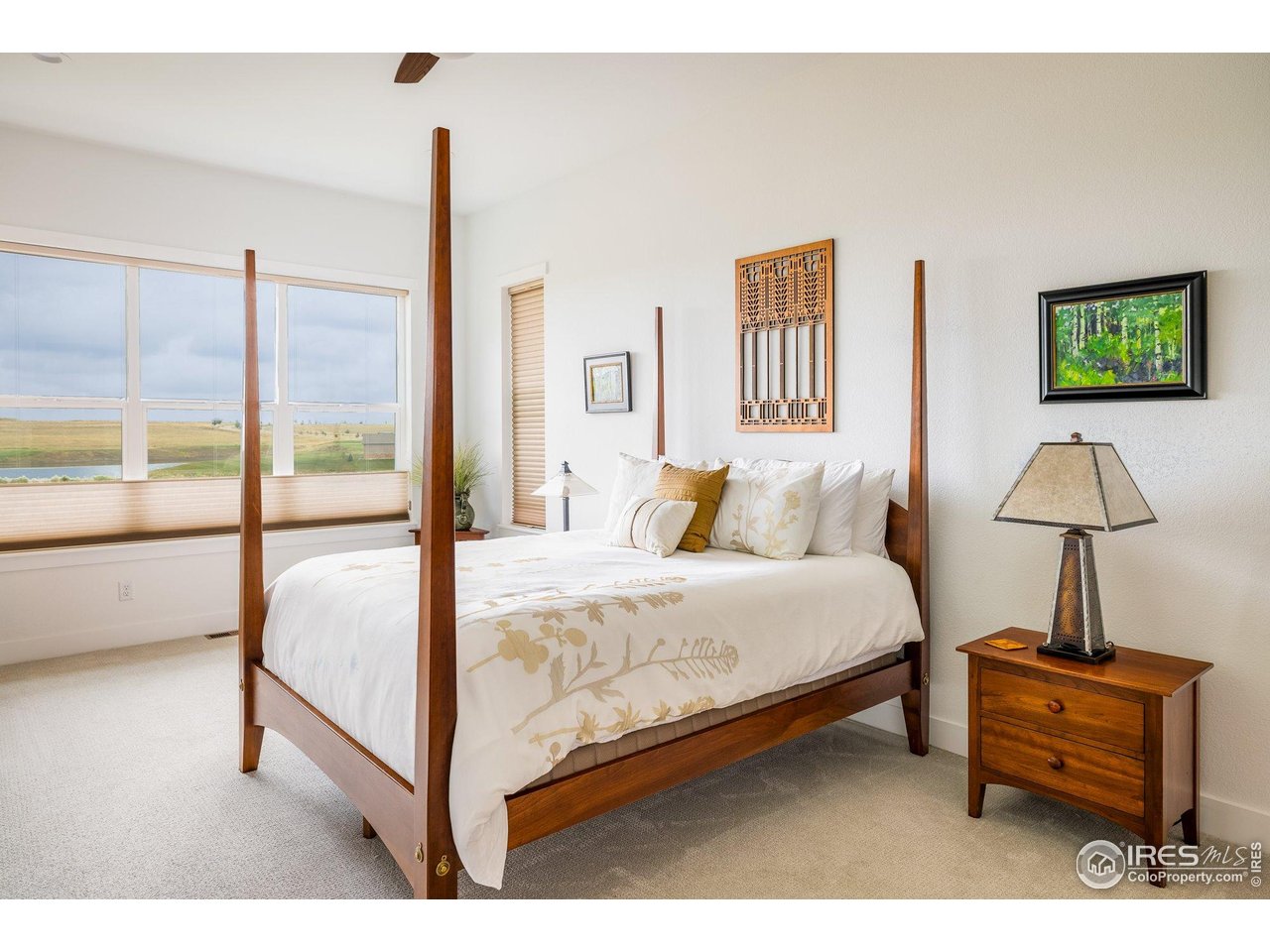 2940 Newfound Lk Road Berthoud, CO 80513 - Photo 16 of 42 a bedroom with a bed and a lamp