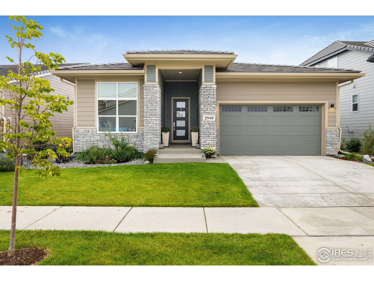 2940 Newfound Lk Road Berthoud, CO 80513 - Photo 2 of 42 a front view of a house with a yard and garage