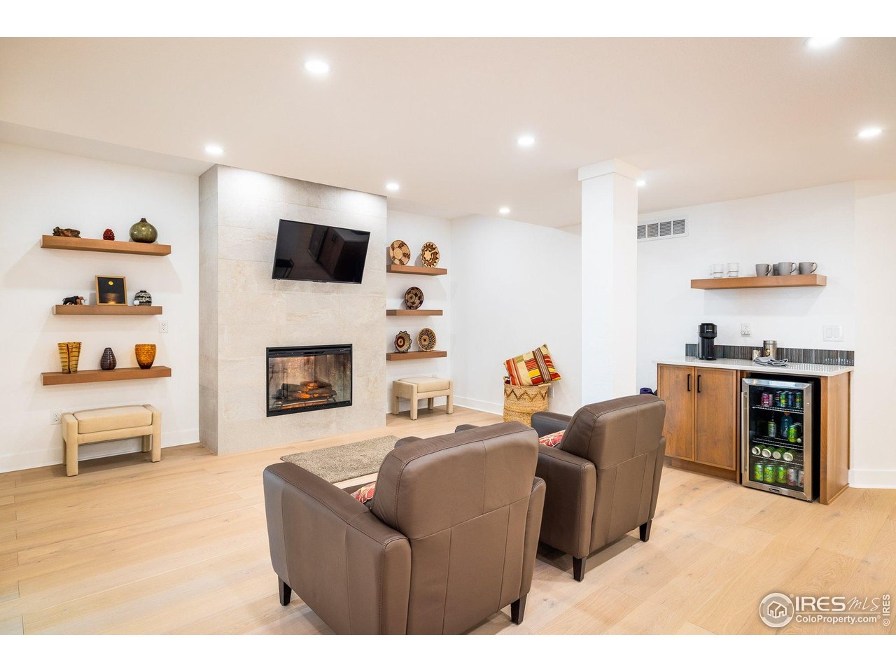 2940 Newfound Lk Road Berthoud, CO 80513 - Photo 23 of 42 a living room with furniture and a fireplace