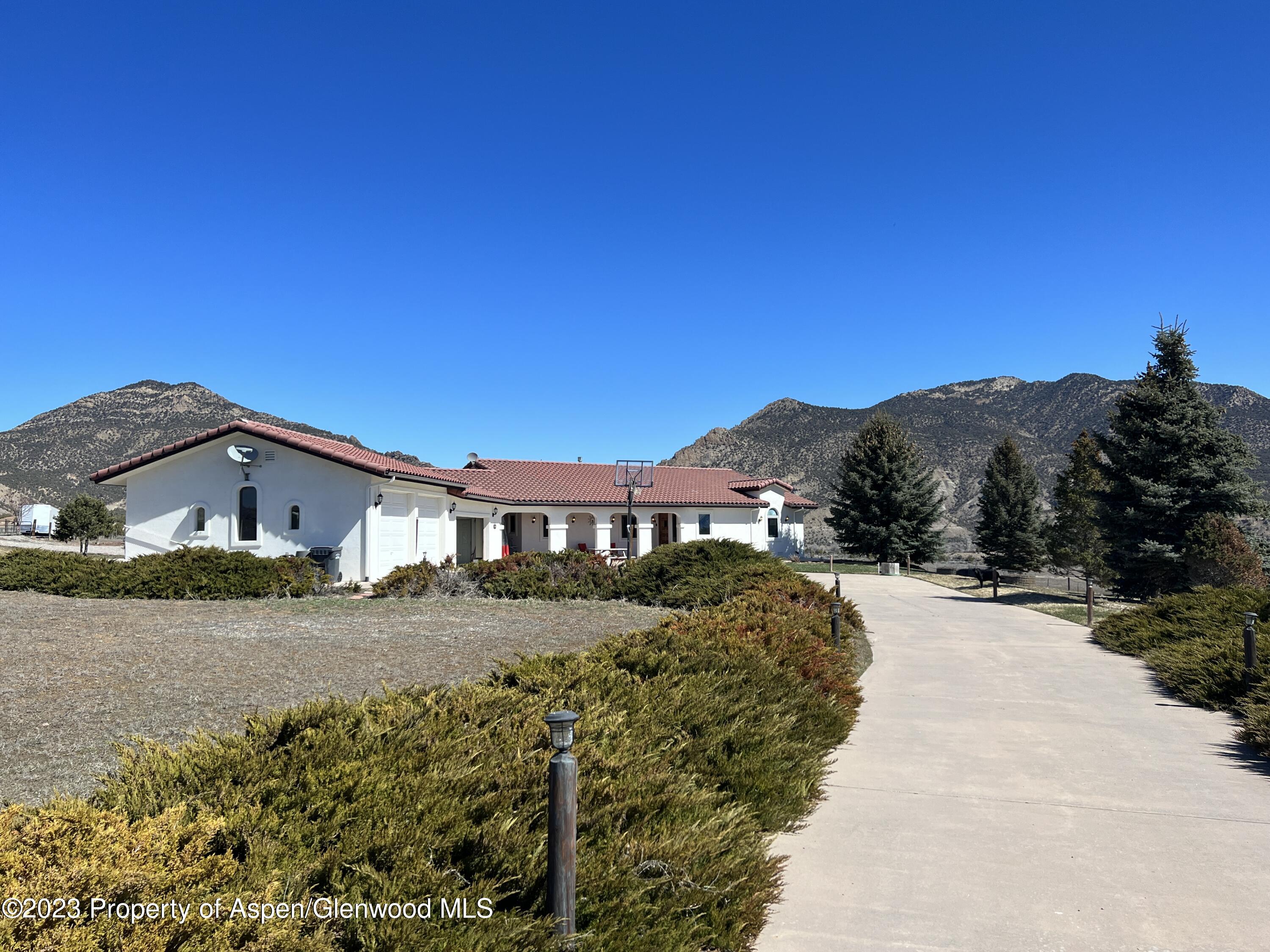 a view of a house with a yard