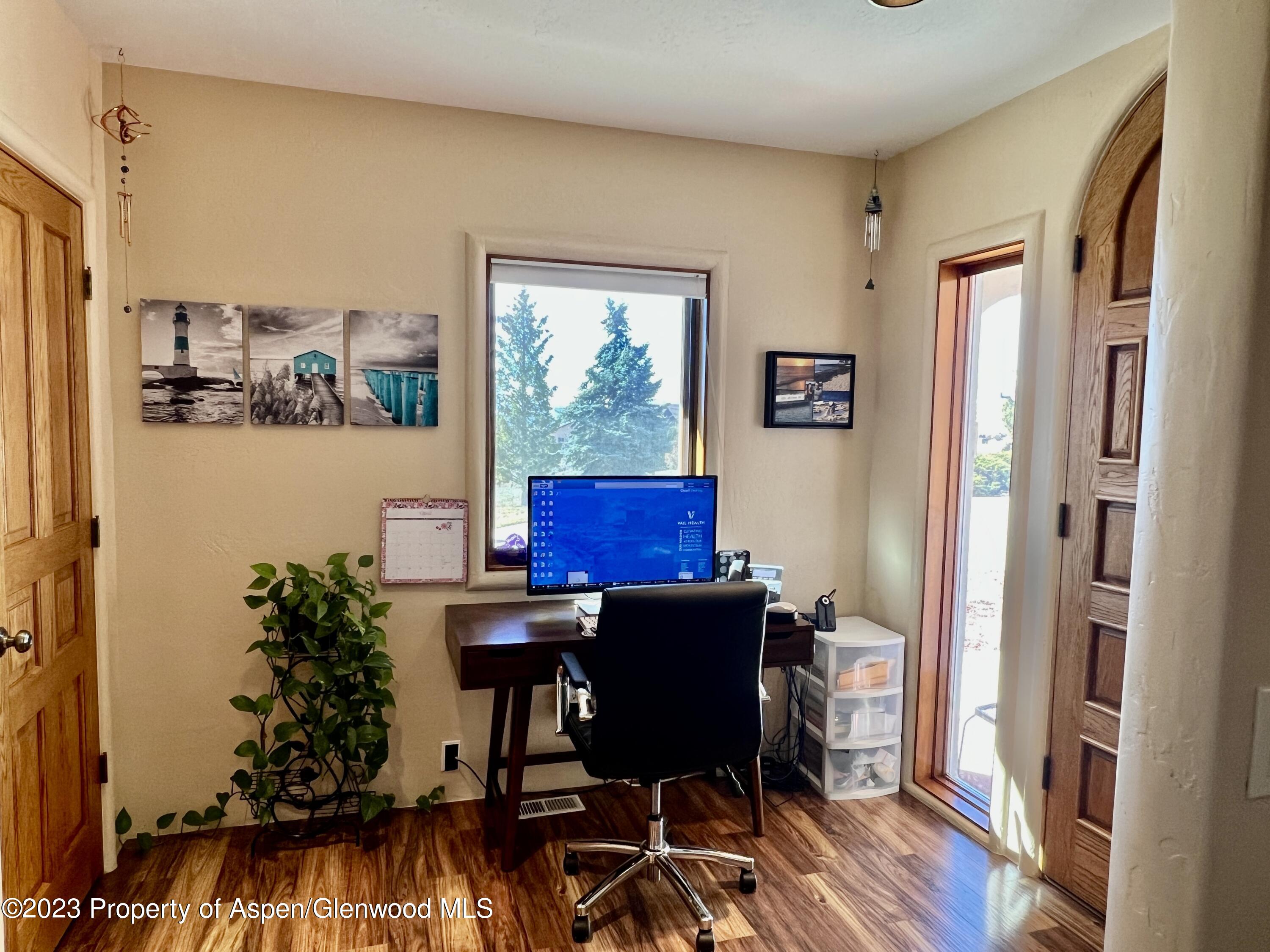 1007 Mesa Drive Rifle, CO 81650 - Photo 11 of 27 a view of a workspace with furniture and a window