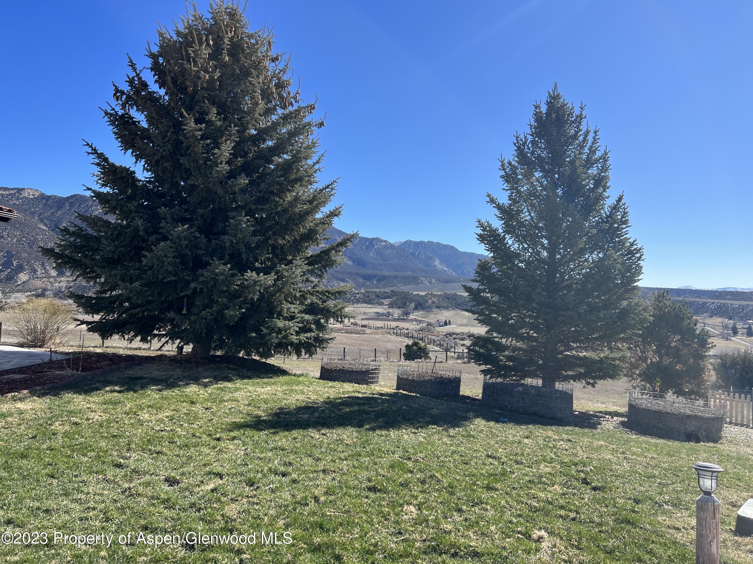 1007 Mesa Drive Rifle, CO 81650 - Photo 25 of 27 a view of a garden with a house