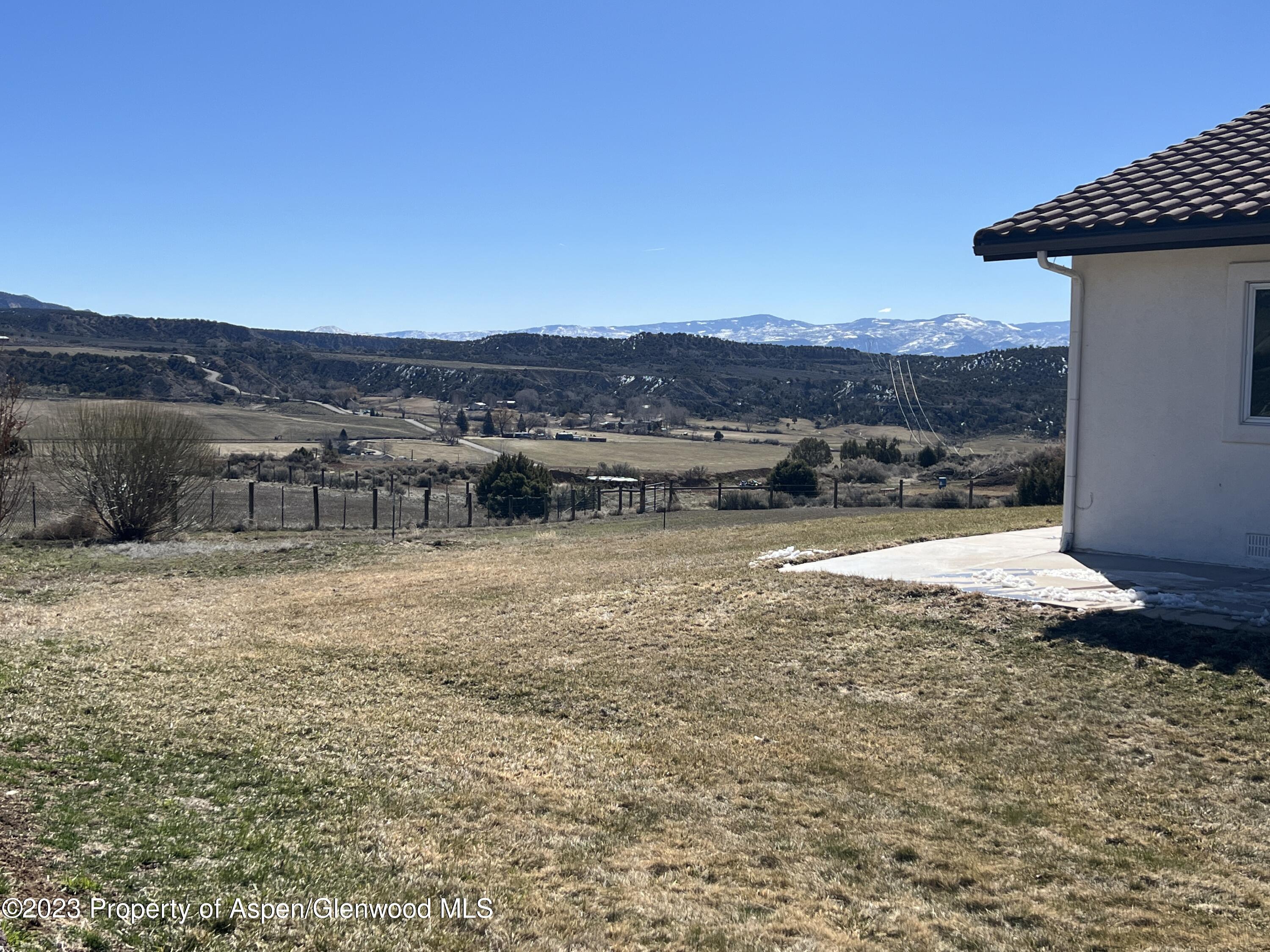 1007 Mesa Drive Rifle, CO 81650 - Photo 26 of 27 a view of a lake with a mountain