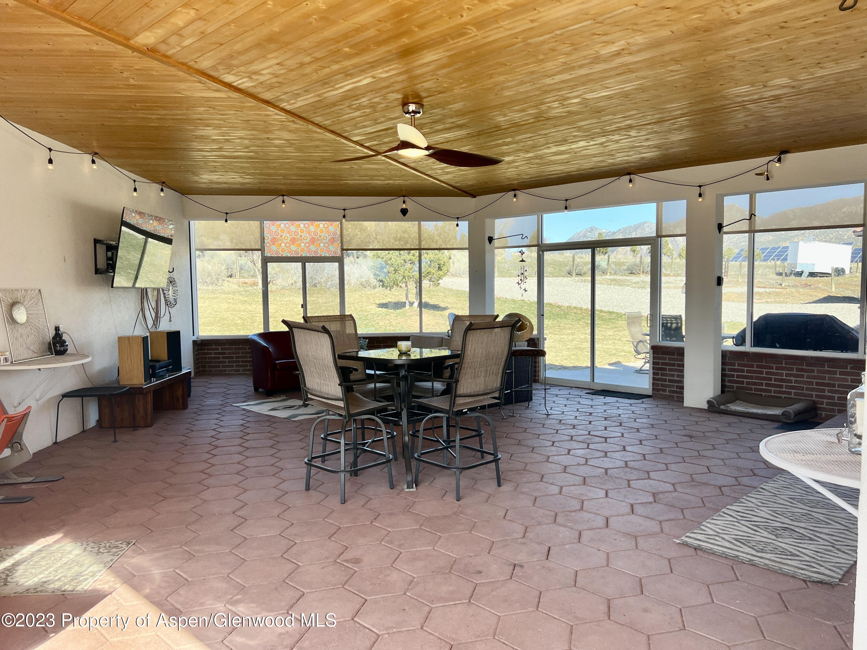 1007 Mesa Drive Rifle, CO 81650 - Photo 5 of 27 a view of a dining room with furniture window and outside view