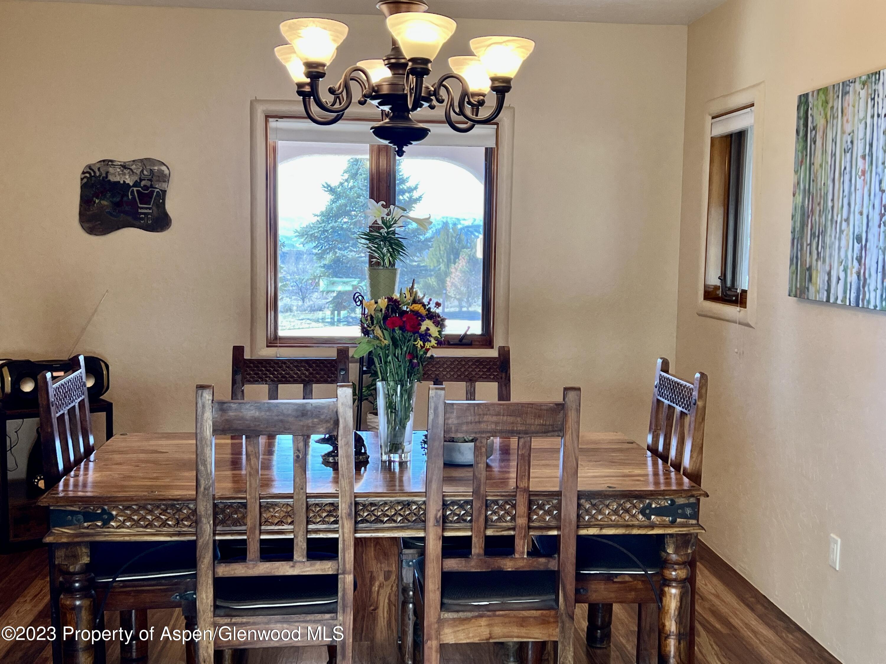 1007 Mesa Drive Rifle, CO 81650 - Photo 9 of 27 a dining room with furniture and chandelier
