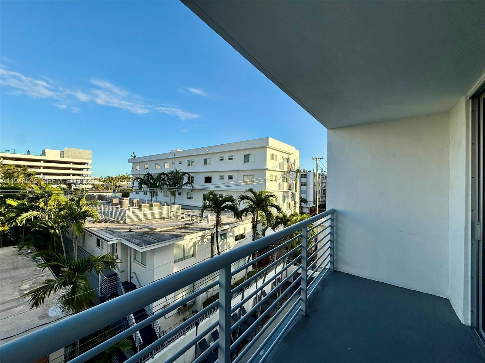 1605 Bay Road, Unit 407 Miami Beach, FL 33139 - Photo 15 of 31 a view of balcony with outdoor seating