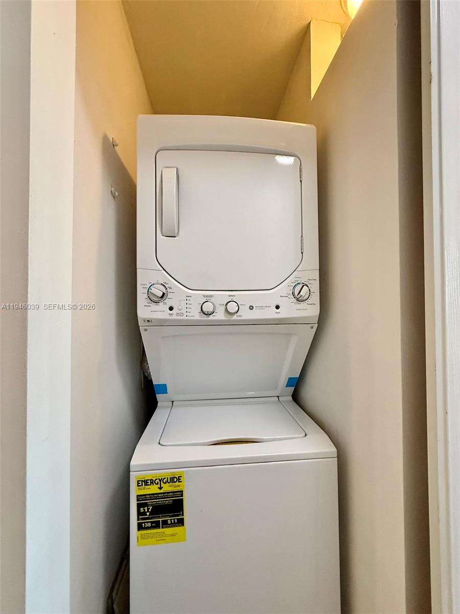 1605 Bay Road, Unit 407 Miami Beach, FL 33139 - Photo 29 of 31 a utility room with dryer and washer