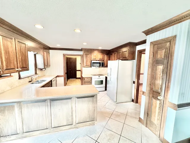 a view of a room with wooden floor and windows