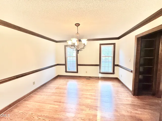 a front view of a house with a large window