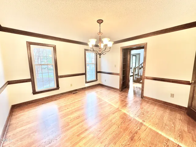 a view of balcony with wooden floor and fence