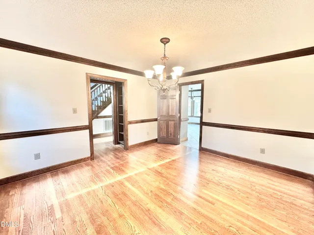 a view of staircase with white walls and a window
