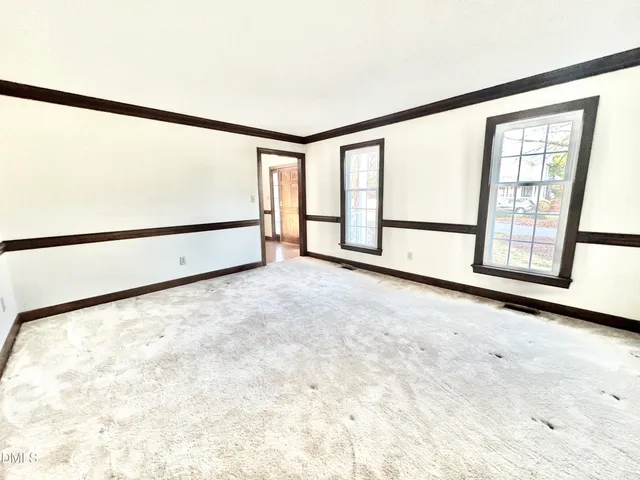 an empty room with windows