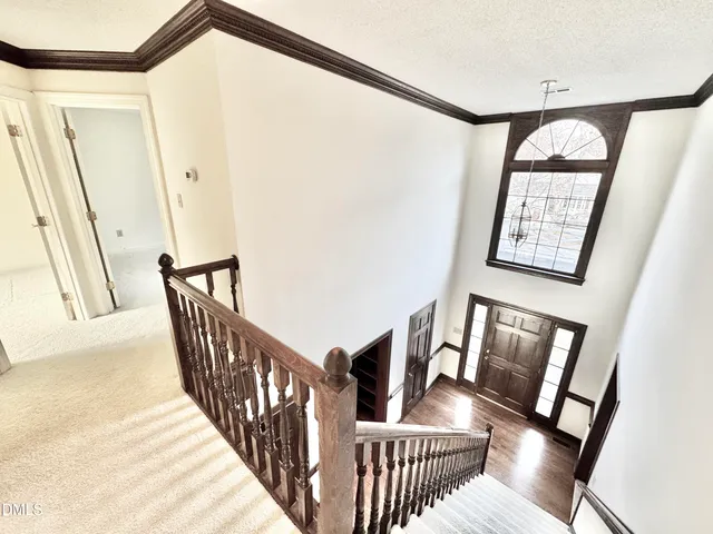 an empty room with a empty space and windows