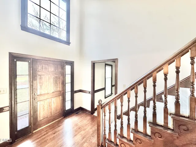 a view of an entryway with wooden floor