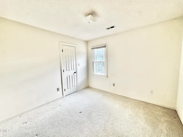 a view of backyard with swimming pool