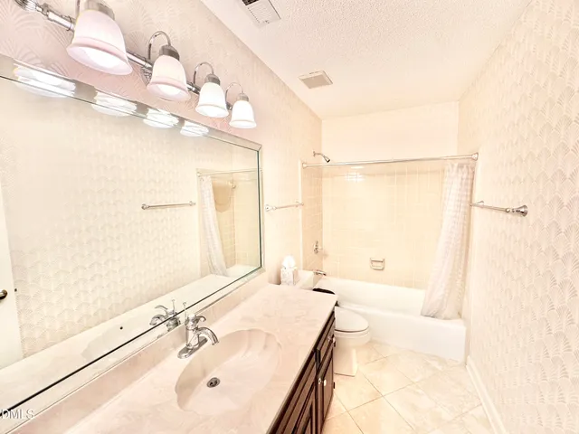 a view of a patio in backyard