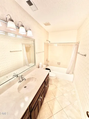 a view of a room with table and chairs