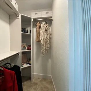 a view of livingroom with furniture and large window