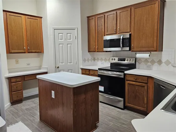 a bathroom with a sink a mirror and a toilet