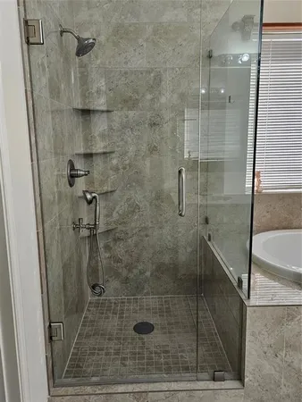 a spacious bathroom with a double vanity sink and mirror