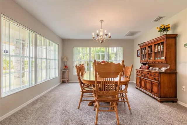 a kitchen with stainless steel appliances granite countertop a sink a stove and a wooden floors