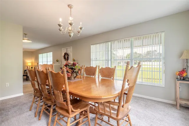 a view of a livingroom with furniture and a window