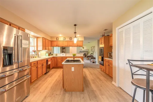 a bed room with a bed and a ceiling fan