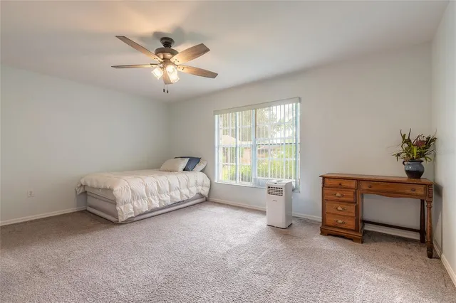 a view of a swimming pool with a yard