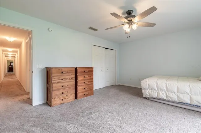 an aerial view of residential houses with outdoor space and swimming pool