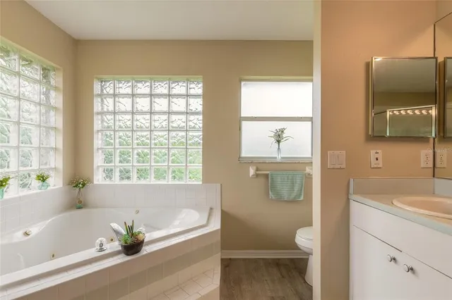 an aerial view of a house with a lake view