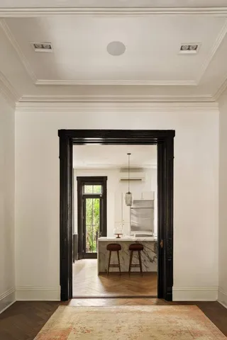 a living room with a table and a window