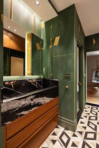 a bathroom with a mirror and a shower