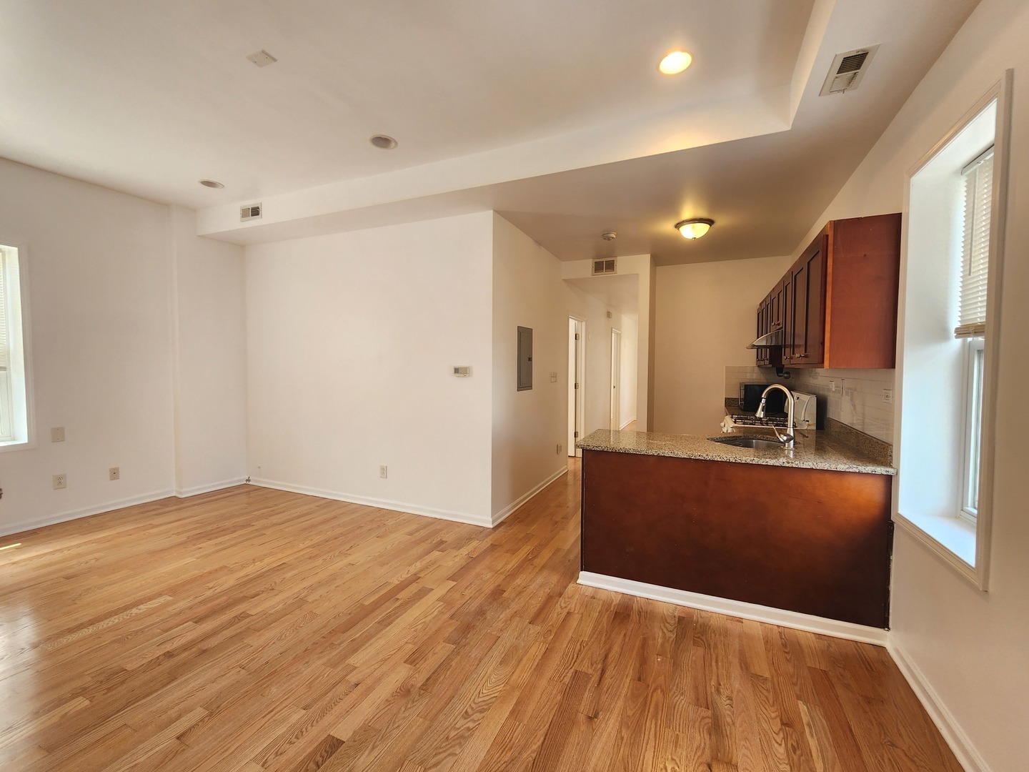 2713 South Crowell Street Chicago, IL 60608 - Photo 28 of 50 a view of a room with wooden floor and a sink