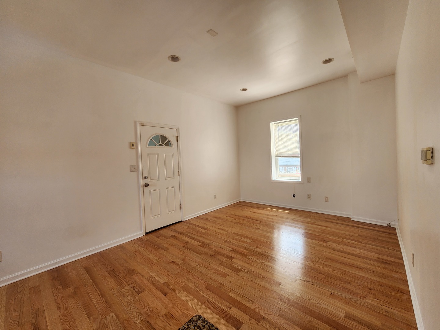 2713 South Crowell Street Chicago, IL 60608 - Photo 29 of 50 a view of empty room with wooden floor and fan