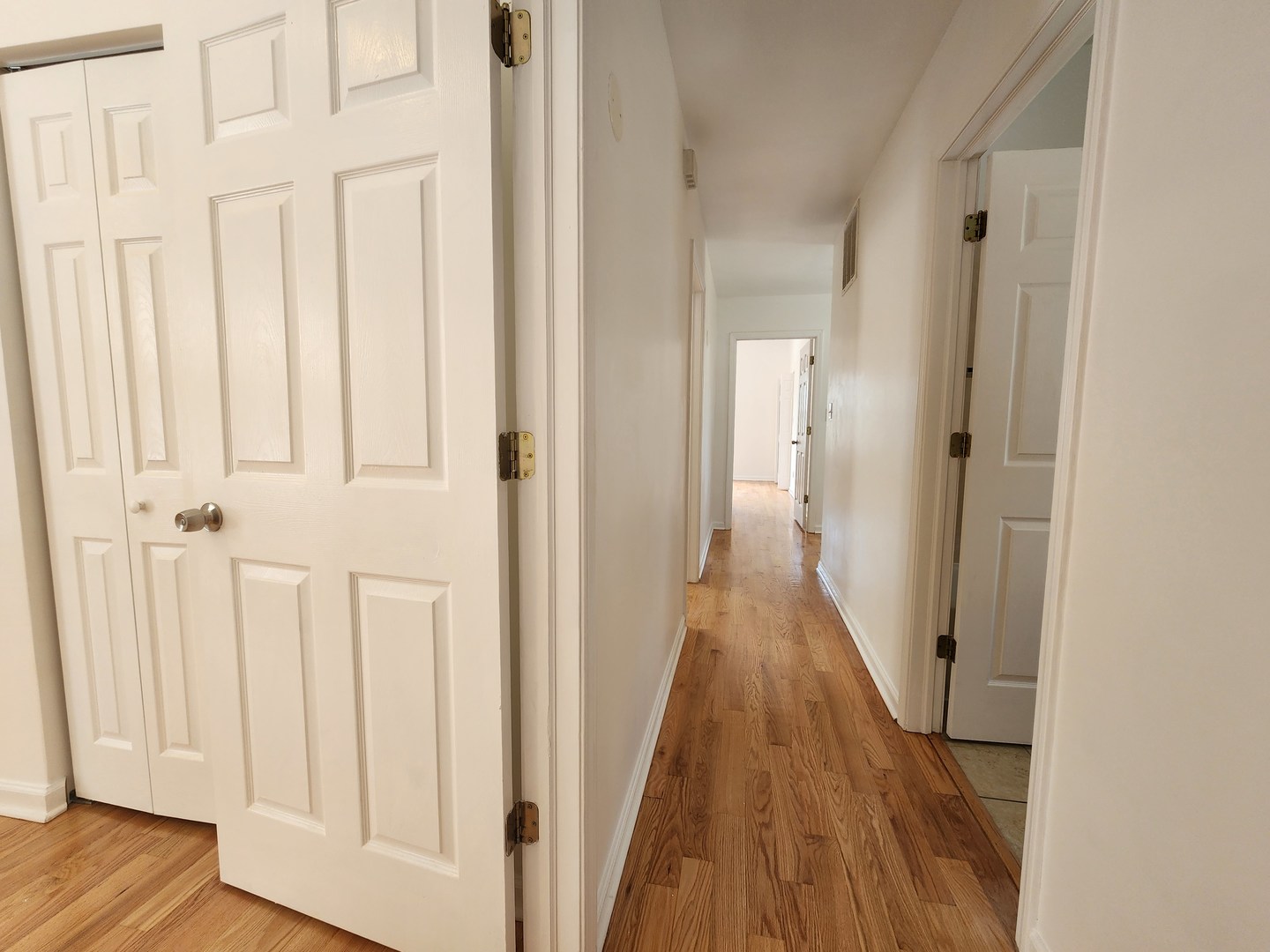 2713 South Crowell Street Chicago, IL 60608 - Photo 31 of 50 a view of a hallway with wooden floor and staircase