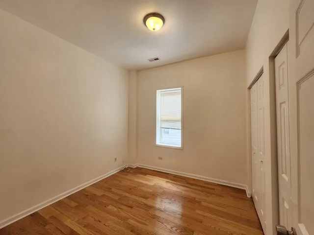 a picture of a bench in front of a wall