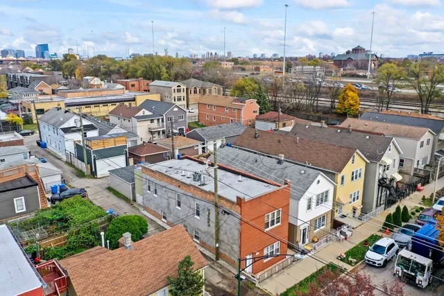an aerial view of multiple houses with outdoor space