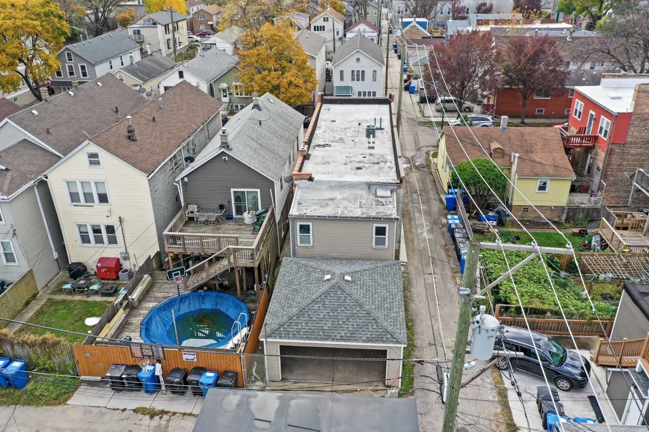 2713 South Crowell Street Chicago, IL 60608 - Photo 50 of 50 an aerial view of multiple houses with outdoor space