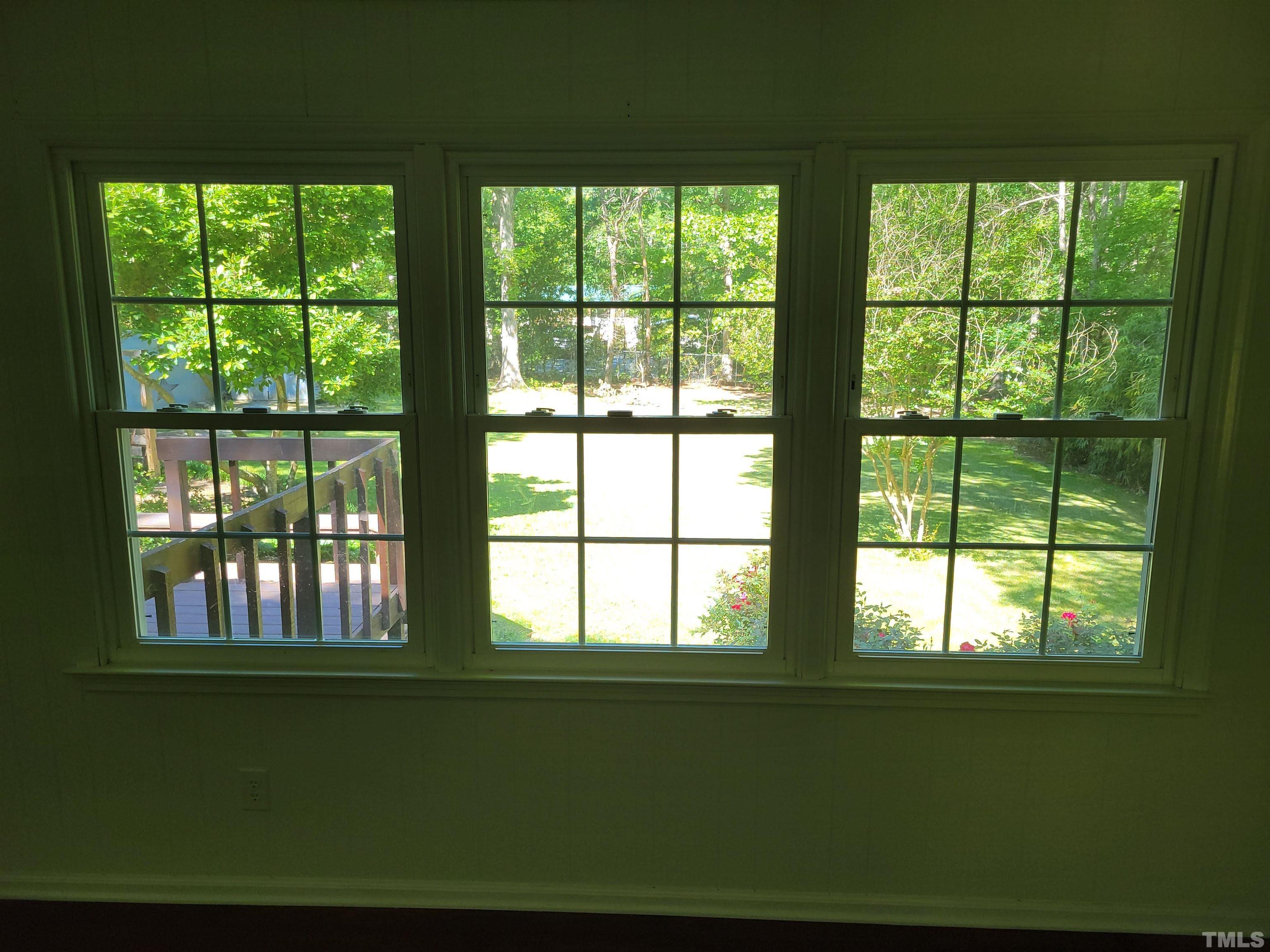 5515 Roslyn Road Durham, NC 27712 - Photo 27 of 38 a living room with large windows
