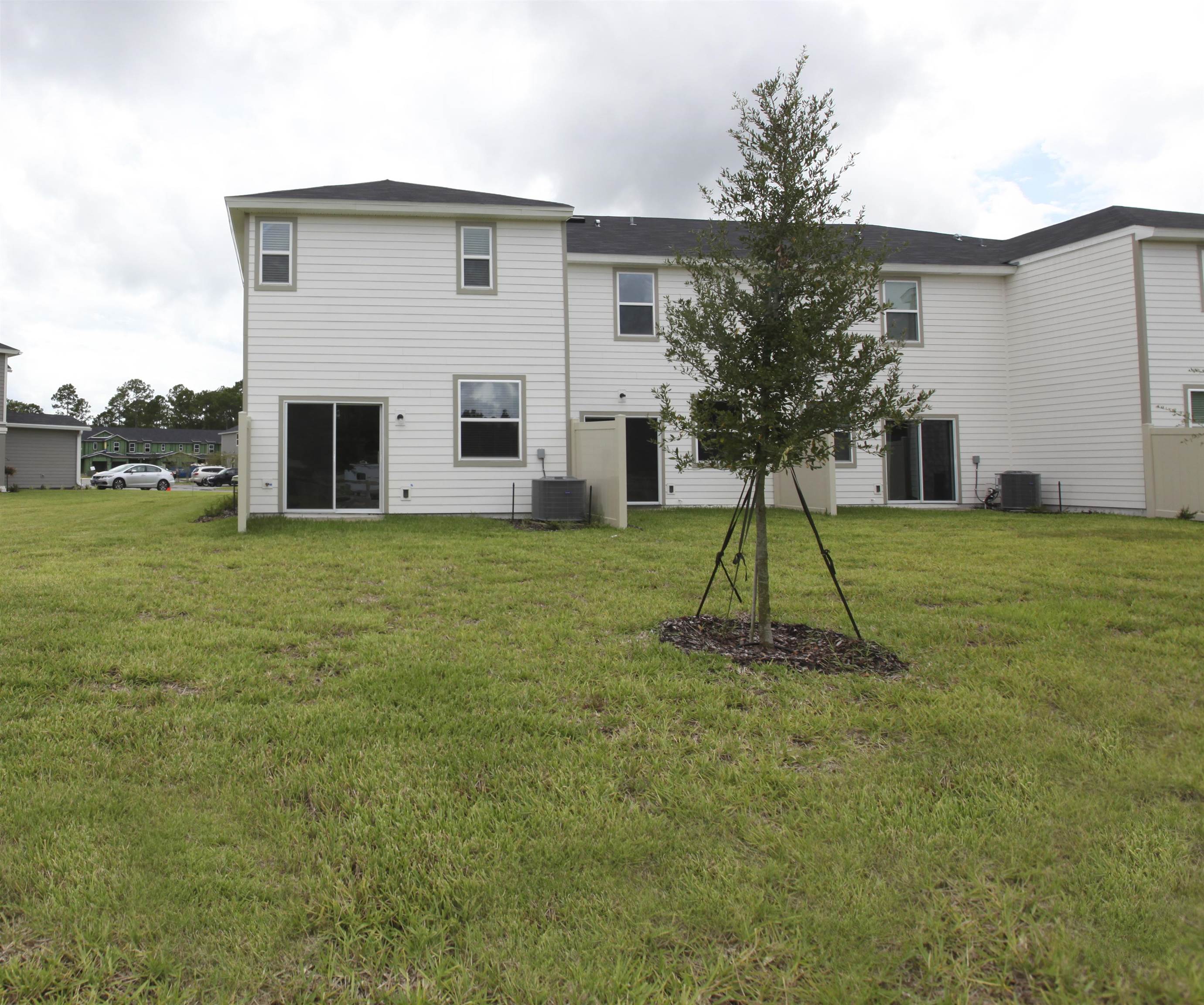 55 Great Star Street St. Augustine, FL 32086 - Photo 37 of 37 a house view with a garden space