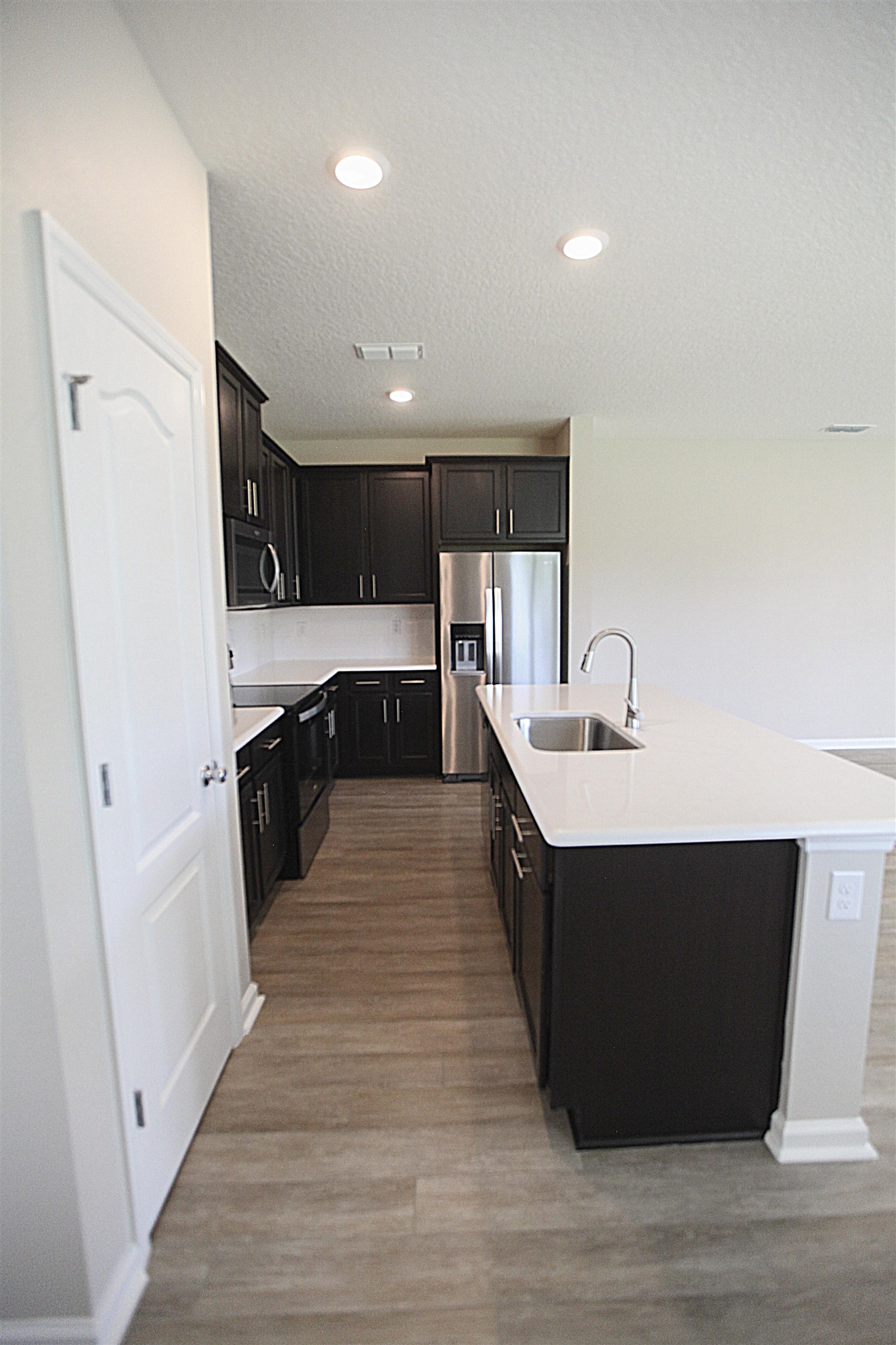 55 Great Star Street St. Augustine, FL 32086 - Photo 8 of 37 a large kitchen with stainless steel appliances a sink and cabinets