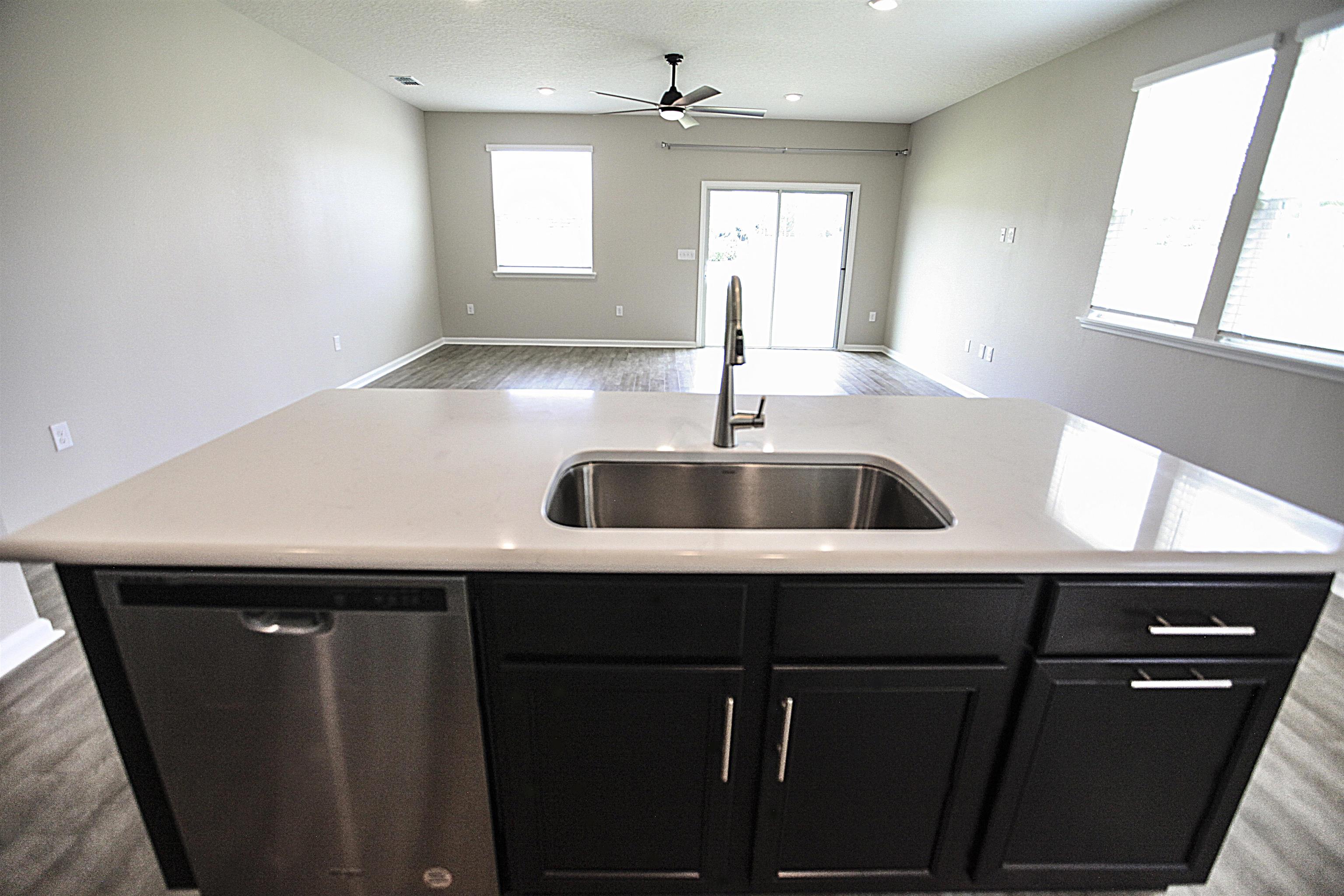 55 Great Star Street St. Augustine, FL 32086 - Photo 10 of 37 a kitchen with a sink cabinets and window