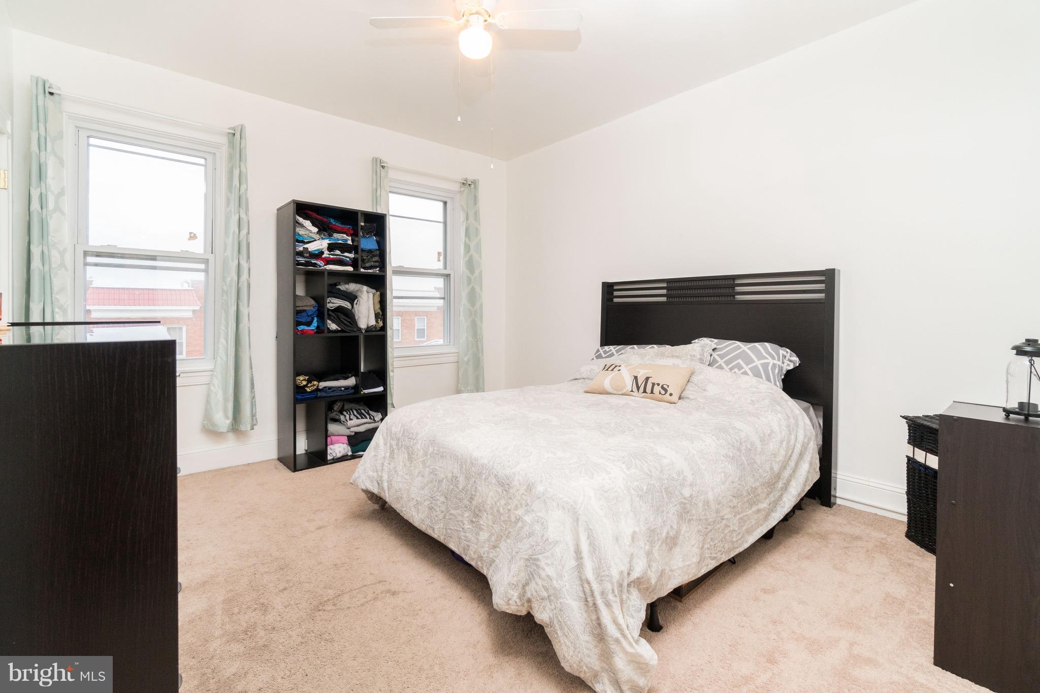 626 Rappolla Street Baltimore, MD 21224 - Photo 14 of 24 a bedroom with a bed and a flat tv screen