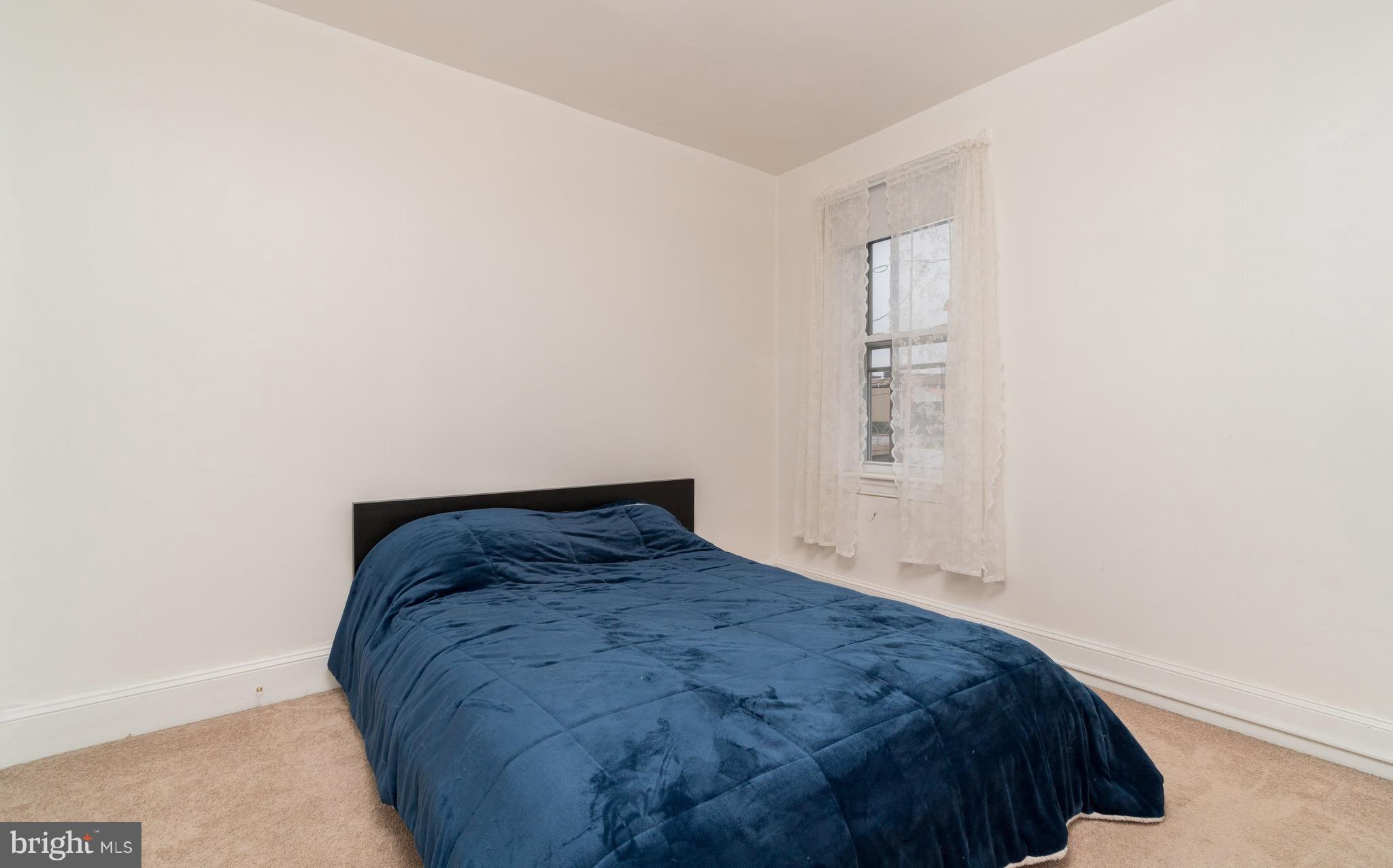 626 Rappolla Street Baltimore, MD 21224 - Photo 18 of 24 a bedroom with a bed and a window