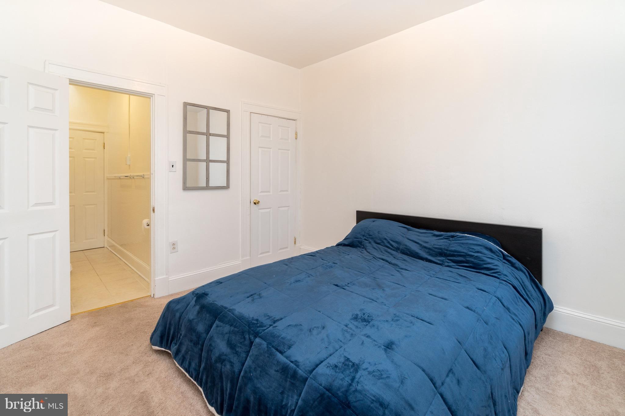 626 Rappolla Street Baltimore, MD 21224 - Photo 19 of 24 a bedroom with a bed and a window
